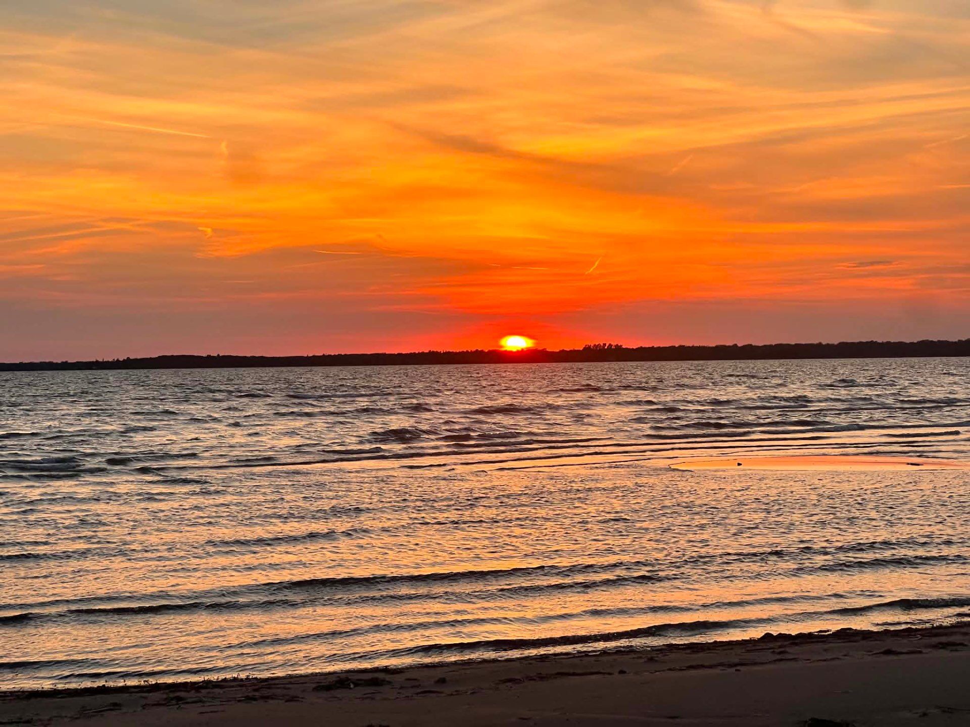 Sunset over rippling waves